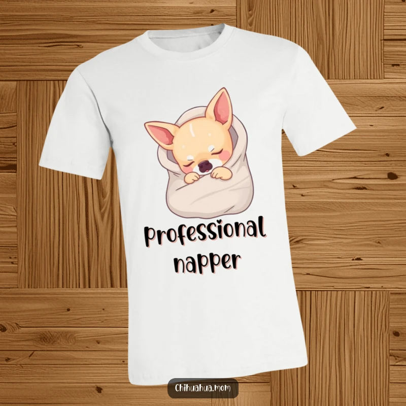 Funny t-shirt displaying a small chihuahua peacefully sleeping while wrapped in a tiny blanket, looking utterly content.